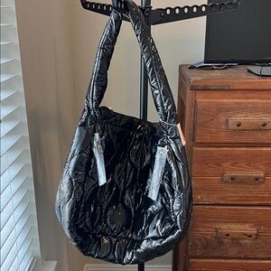 Free People movement Surplus Shine Carryall Bag. NWT. Black